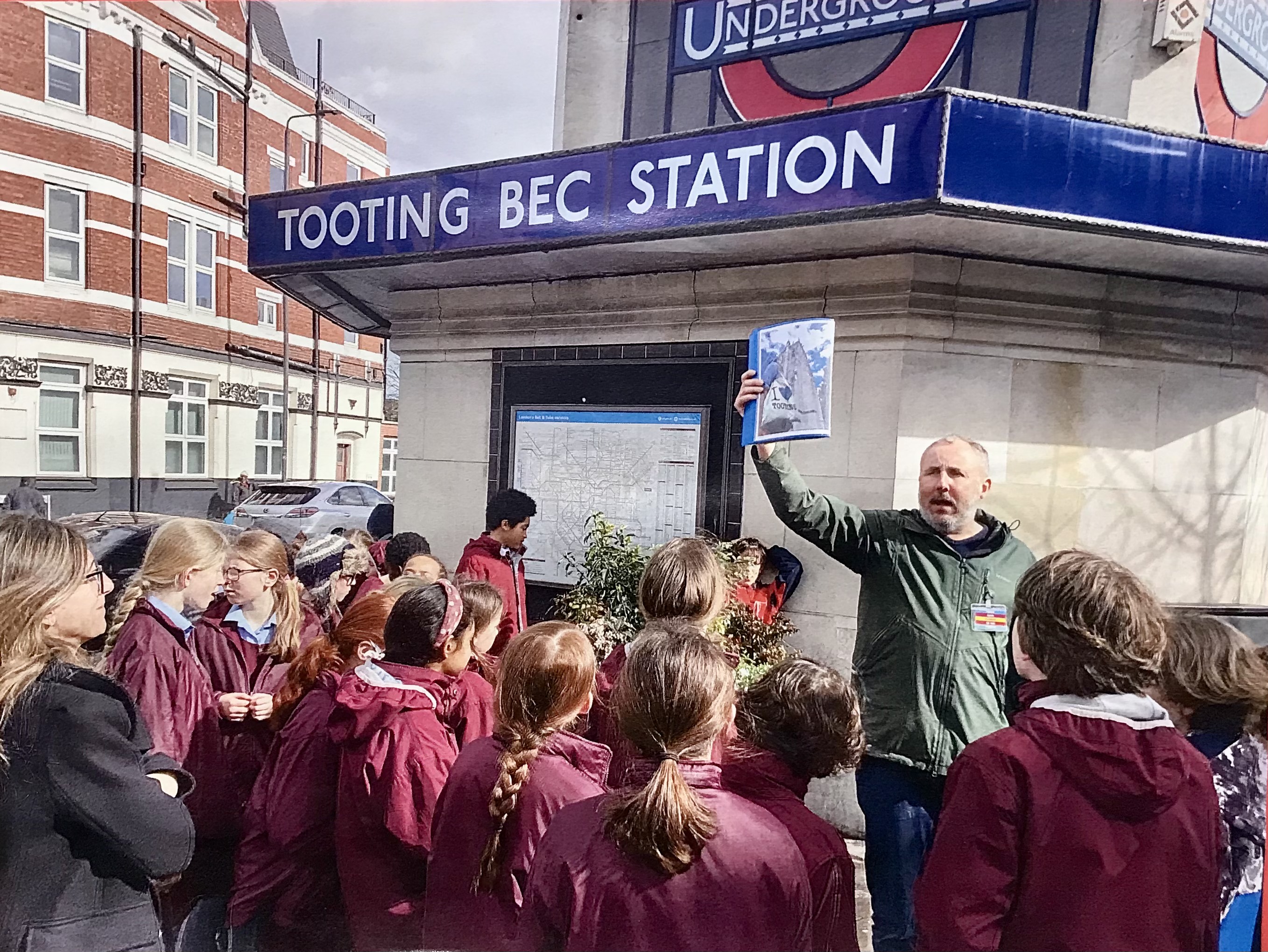 A guided walk gathering outside Tooting Bec station